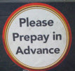 Sticker on the gas pump says, "Please prepay in advance"